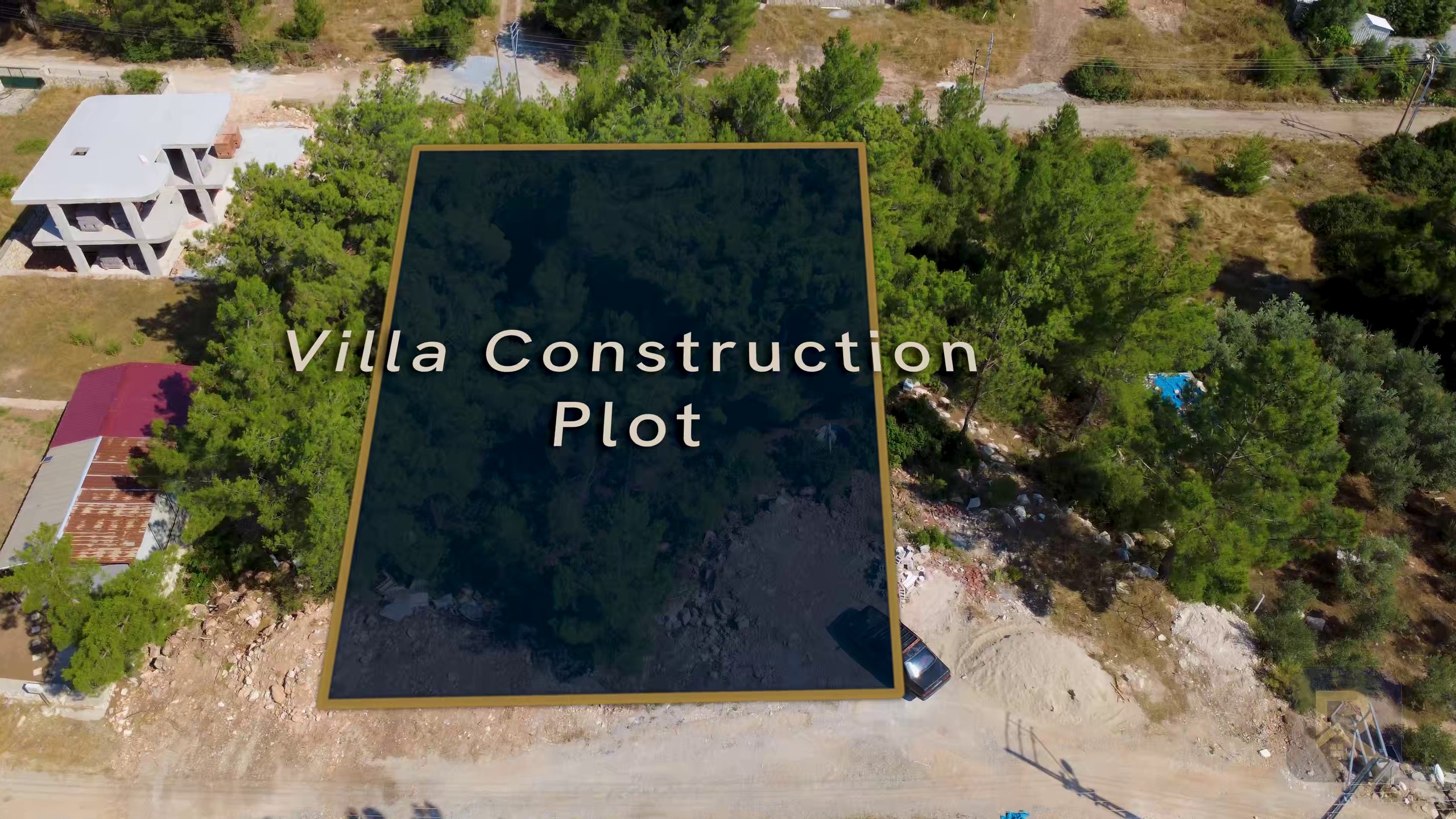 Aerial view of plot RR 888/1 in Seyrantepe, Didim — a pine-covered building plot with road frontage